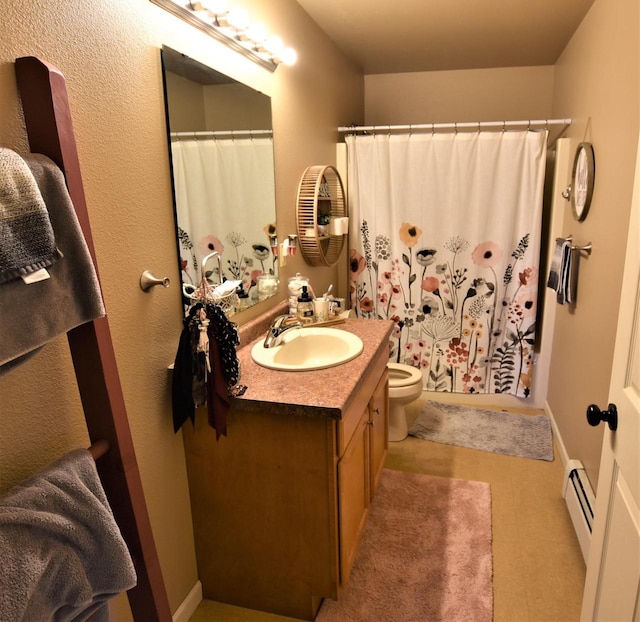 bathroom featuring a shower with shower curtain, vanity, a baseboard radiator, and toilet