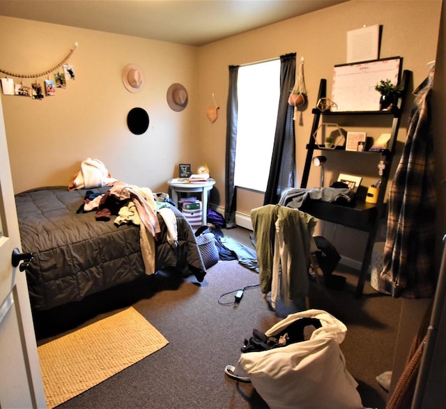 bedroom featuring carpet and a baseboard radiator