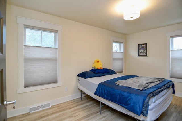 bedroom featuring hardwood / wood-style floors