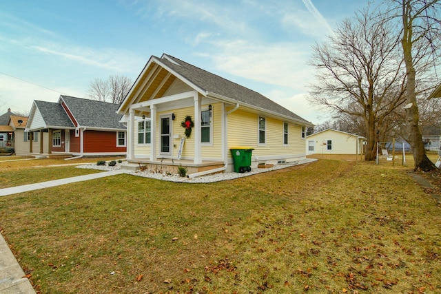 view of front facade with covered porch and a front lawn