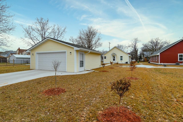 exterior space featuring a garage and a front lawn