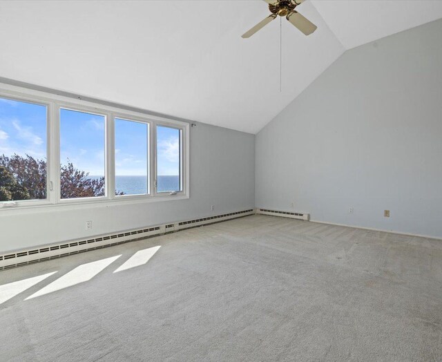 interior space with carpet, lofted ceiling, a water view, ceiling fan, and a baseboard radiator