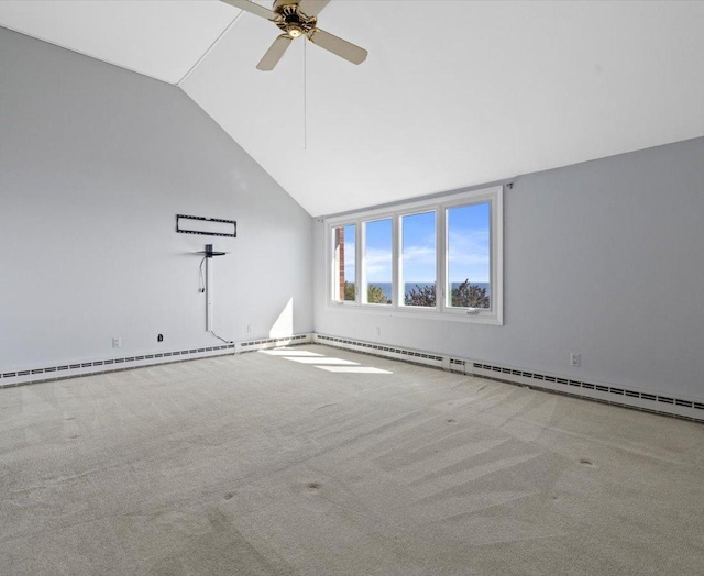 spare room featuring ceiling fan, light colored carpet, and lofted ceiling