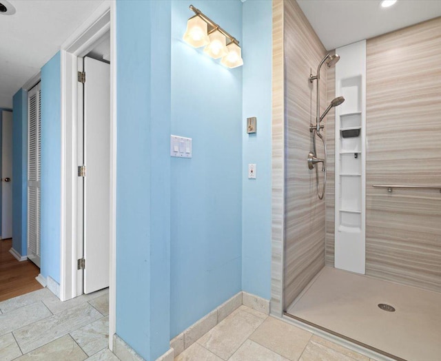 bathroom with tiled shower