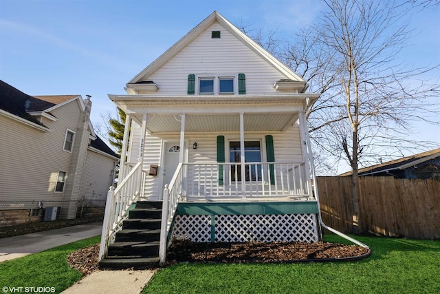 view of front facade featuring a front lawn and covered porch