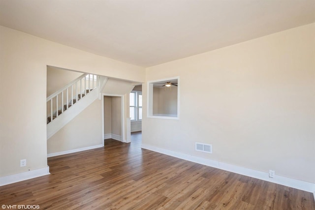 unfurnished room with hardwood / wood-style flooring