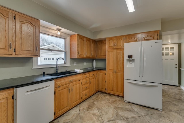 kitchen with white appliances and sink