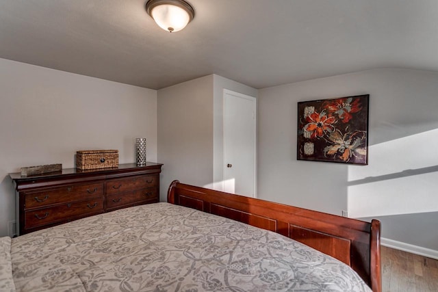 bedroom with hardwood / wood-style flooring