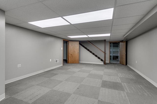 basement featuring a drop ceiling