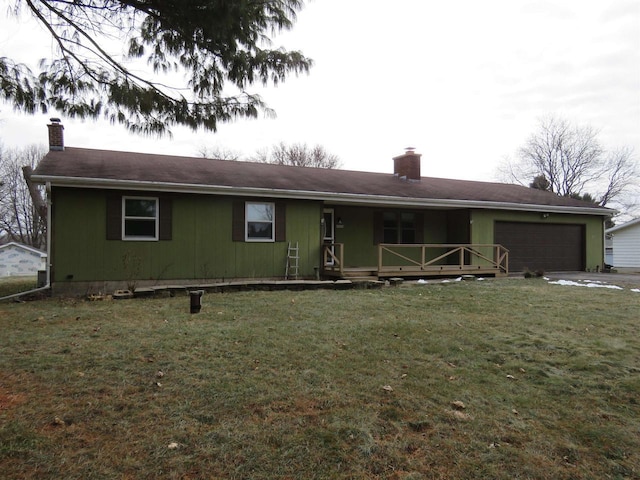 view of front facade featuring covered porch, a front yard, and a garage