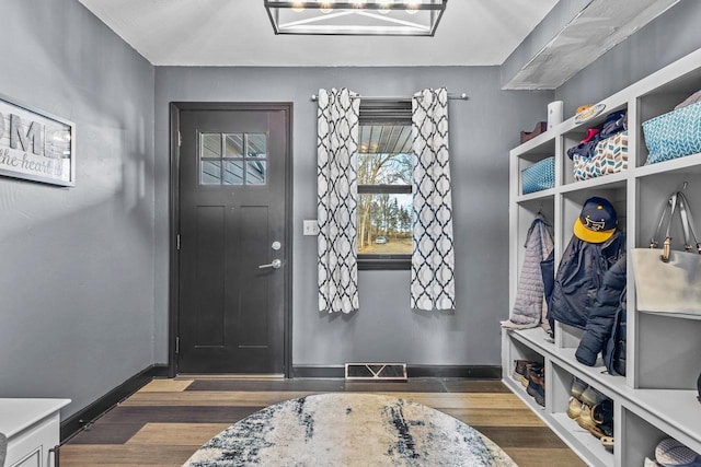 mudroom with dark hardwood / wood-style floors