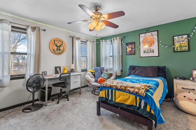 carpeted bedroom featuring ceiling fan