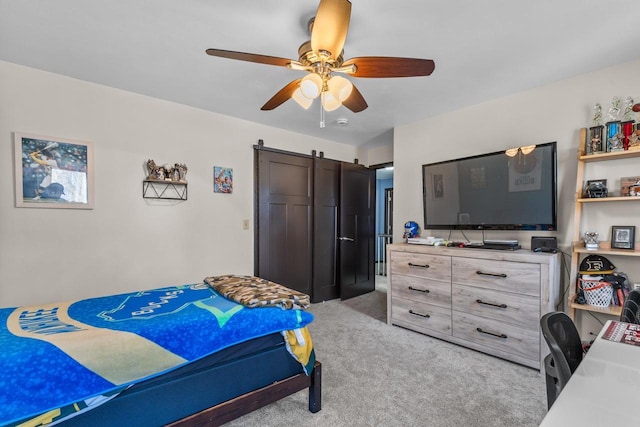 bedroom featuring light carpet and ceiling fan