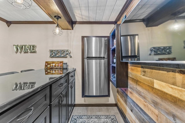 kitchen with stainless steel fridge, light hardwood / wood-style flooring, wood ceiling, and decorative light fixtures