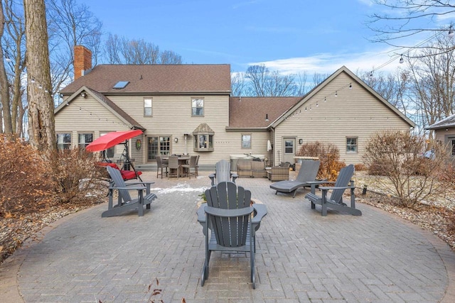 rear view of house featuring a patio area