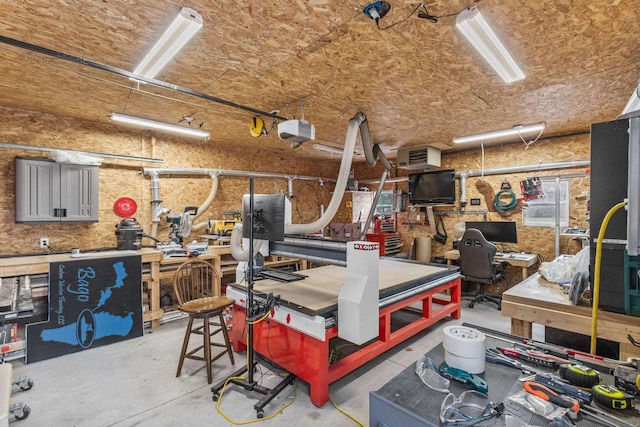 garage featuring a workshop area and a garage door opener