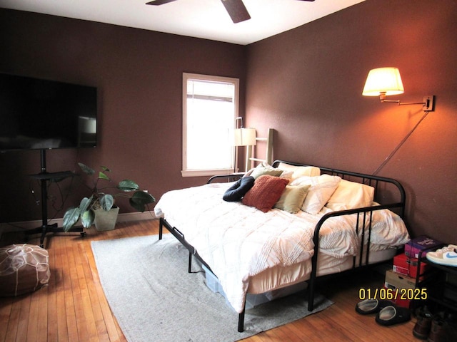 bedroom featuring hardwood / wood-style flooring and ceiling fan