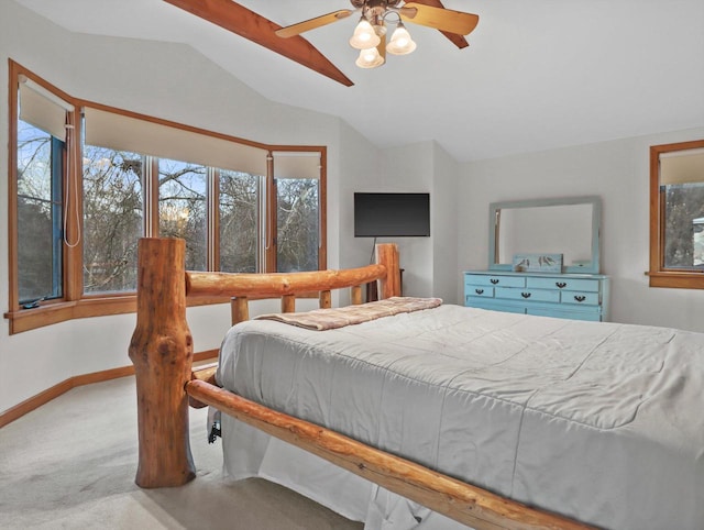 carpeted bedroom featuring ceiling fan and lofted ceiling