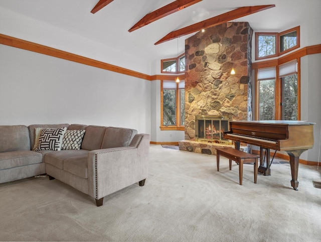 carpeted living room featuring a stone fireplace, beamed ceiling, and high vaulted ceiling