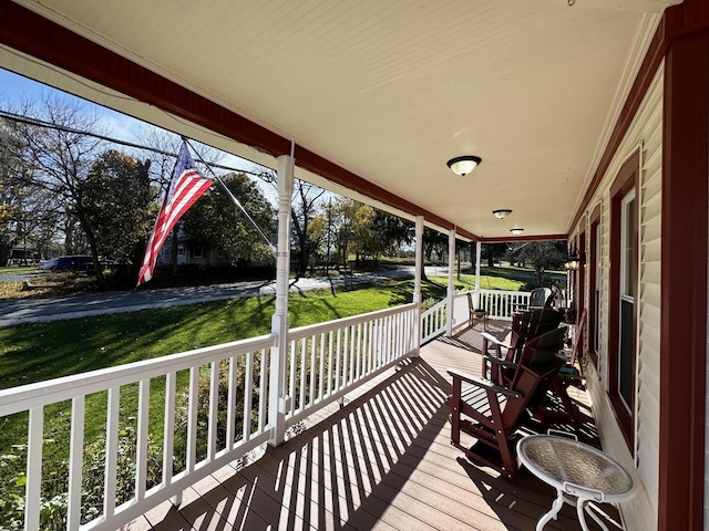 wooden terrace with a porch