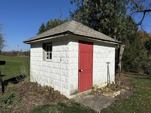 view of outdoor structure with a lawn