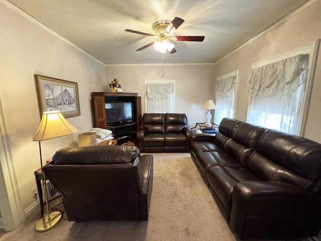 living room featuring ceiling fan, light colored carpet, and ornamental molding