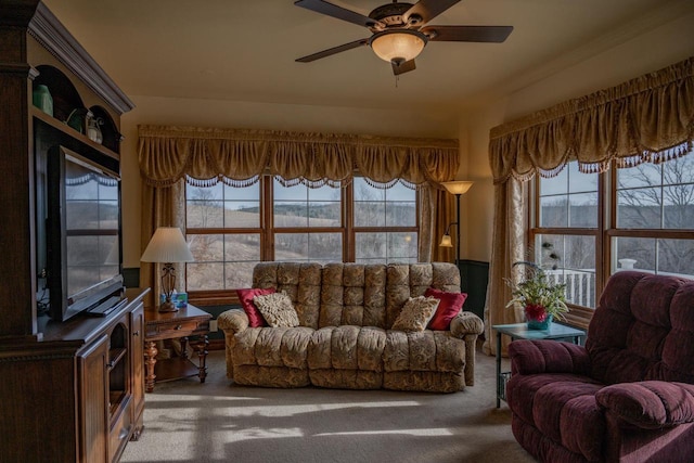 carpeted living room with plenty of natural light and ceiling fan