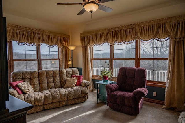 living room with ceiling fan, carpet, and a healthy amount of sunlight