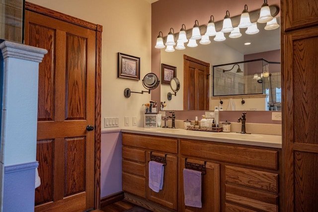 bathroom with vanity and a shower with shower door