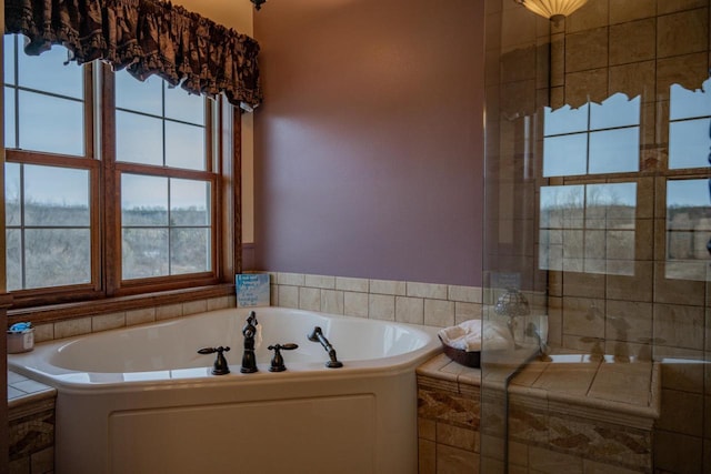 bathroom with tiled bath