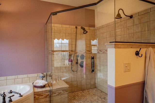 bathroom featuring separate shower and tub