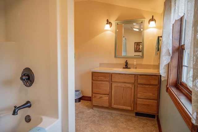 bathroom featuring shower / bathing tub combination and vanity