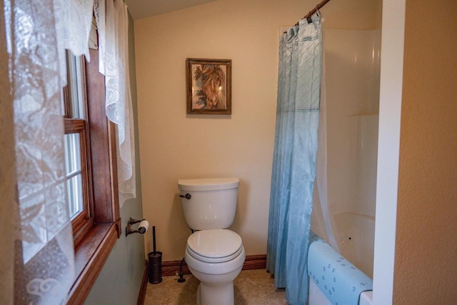 bathroom featuring toilet and shower / bathtub combination with curtain