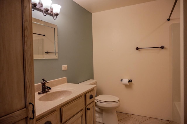 bathroom featuring toilet, vanity, and tile patterned floors