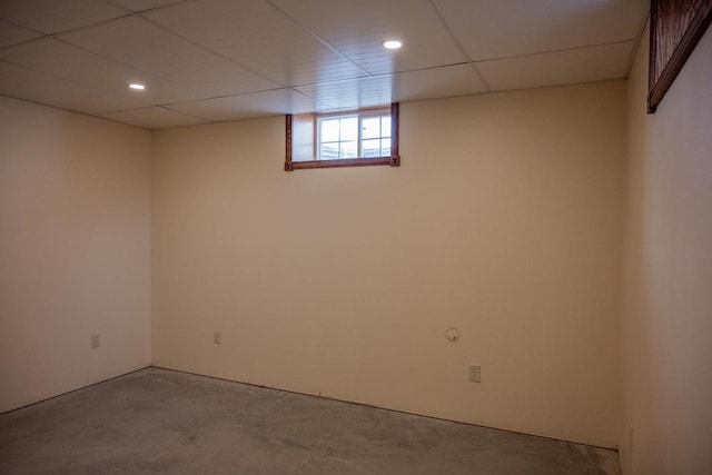 basement featuring a paneled ceiling