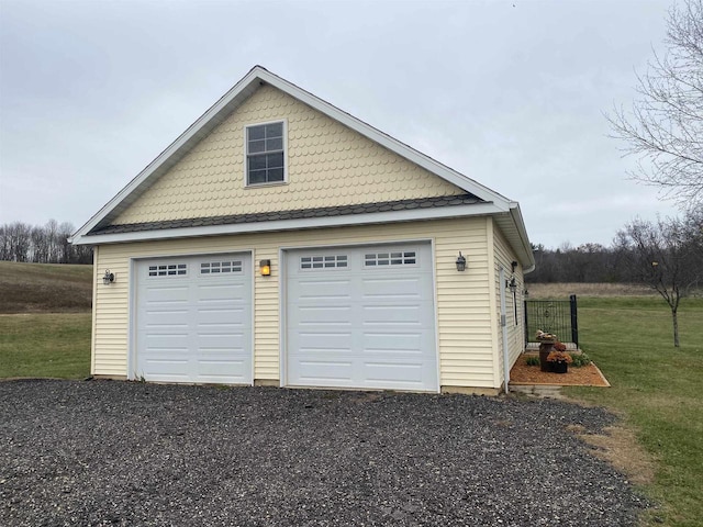 garage featuring a yard