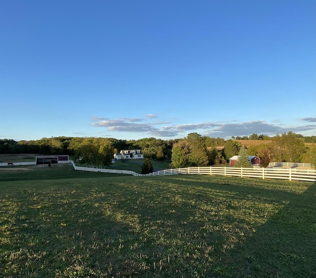 view of yard with a rural view