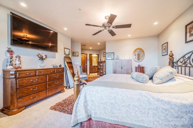 bedroom with ceiling fan and carpet floors