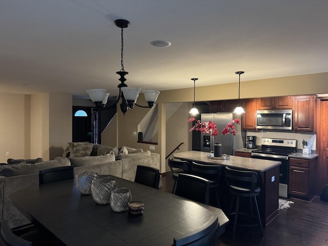 dining area with a notable chandelier and dark wood-type flooring