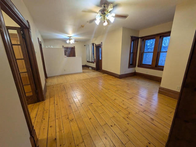 unfurnished room with ceiling fan and light hardwood / wood-style flooring