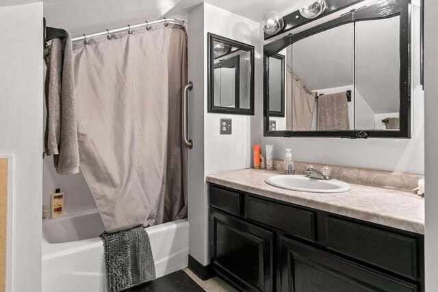 bathroom with vanity and shower / tub combo