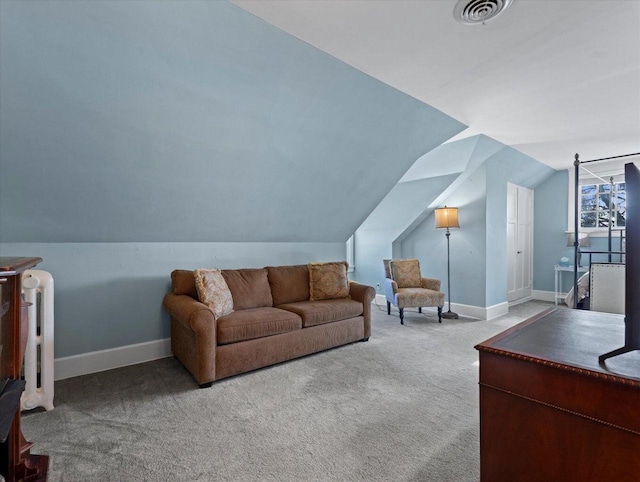 living room featuring carpet flooring and vaulted ceiling