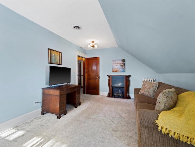 living room featuring light carpet and vaulted ceiling