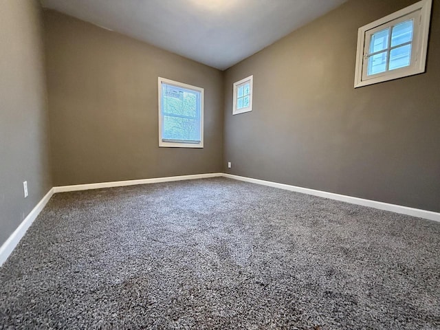 unfurnished room with carpet floors