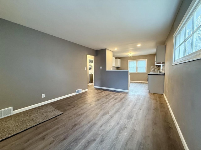 unfurnished living room featuring light hardwood / wood-style floors