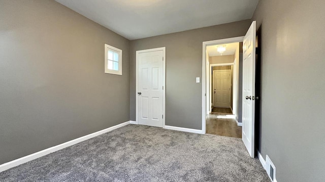 unfurnished bedroom with carpet flooring