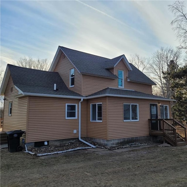 rear view of property with a yard