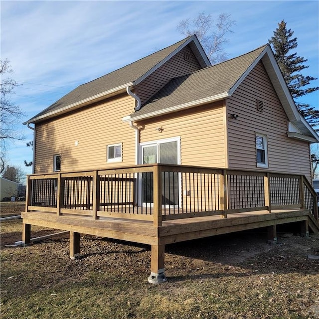 rear view of property with a wooden deck