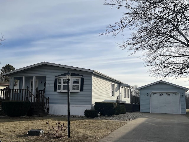 manufactured / mobile home featuring an outbuilding and a garage