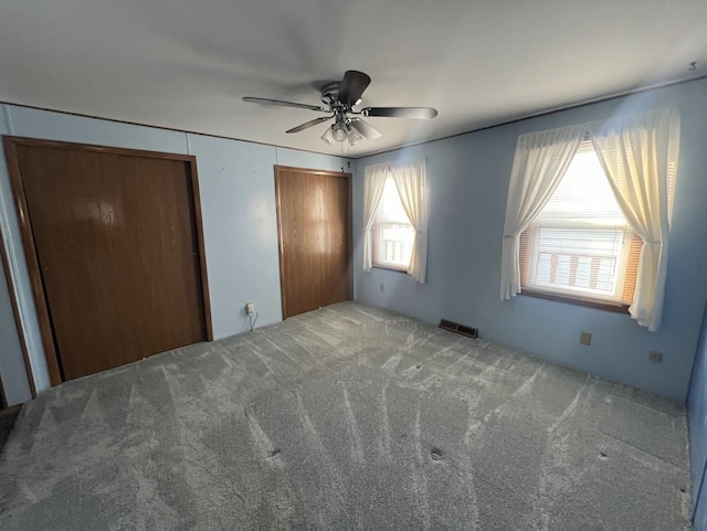 521 Oak Lodge Rd, Waterford, WI 53185 - unfurnished bedroom featuring carpet flooring and ceiling fan